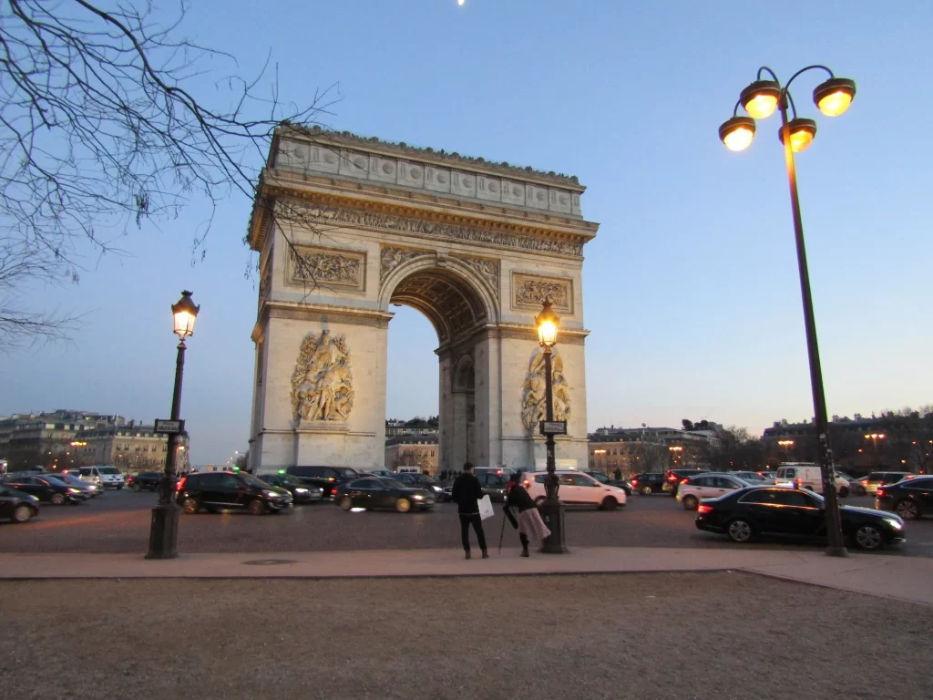 Arc de Triomphe during the day with a blue-sky background