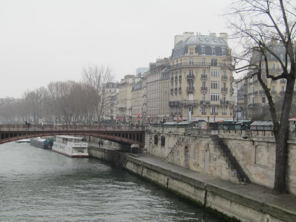 Gray, rainy view of a bridge over the Seine River